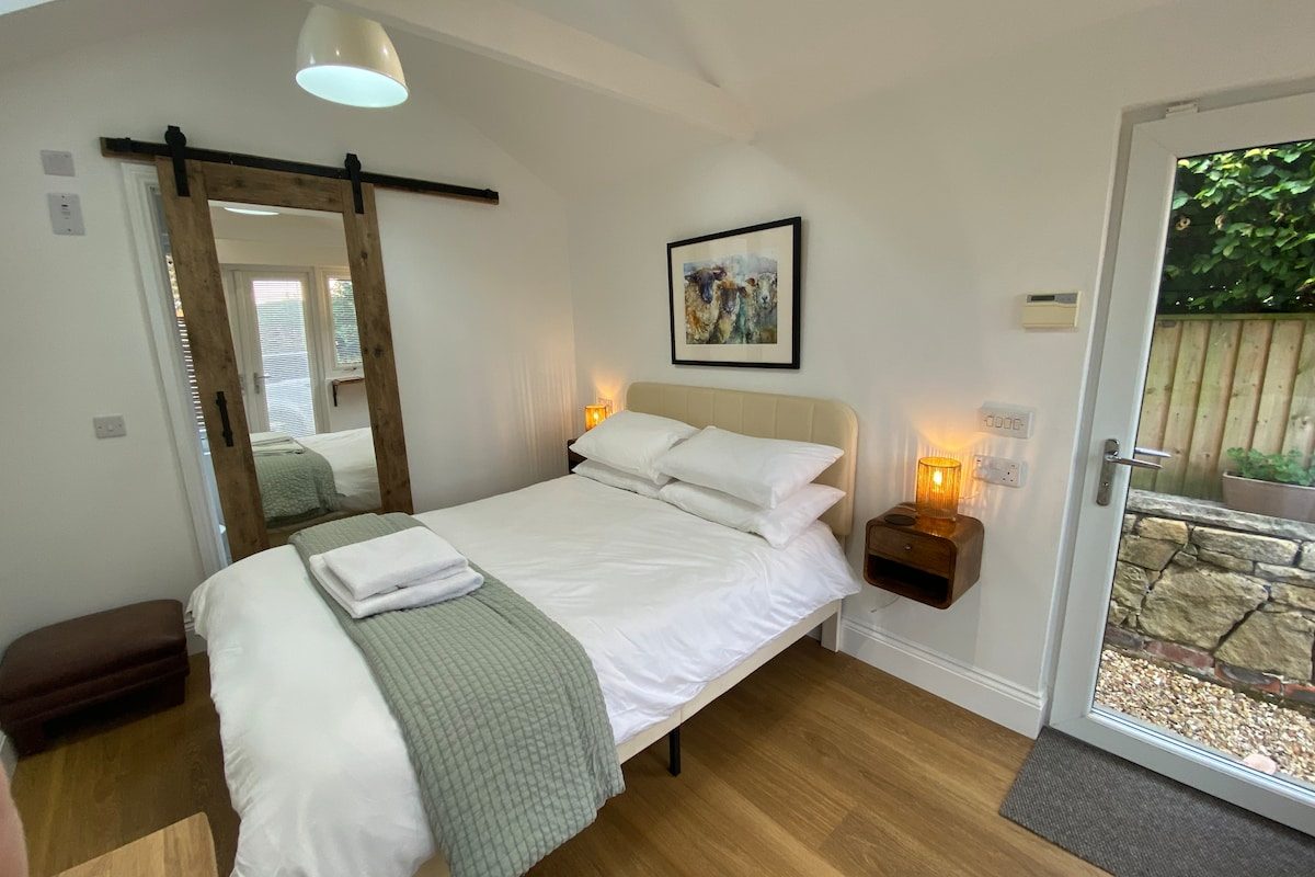 Bedroom view towards the mirrored sliding door and private entrance